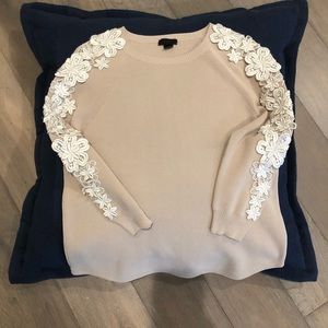 J.Crew Tan sweater with embroidered white flowers.